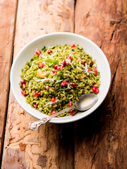 Hariyali Poha / Green Masala Pohe or flattened rice served in a bowl, selective focus