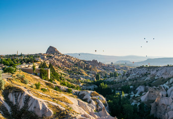 Uçhisar Castle with hot air ballons, Turkey