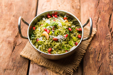 Hariyali Poha / Green Masala Pohe or flattened rice served in a bowl, selective focus