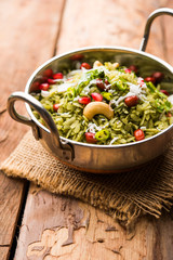 Hariyali Poha / Green Masala Pohe or flattened rice served in a bowl, selective focus
