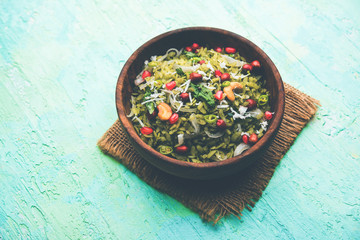 Hariyali Poha / Green Masala Pohe or flattened rice served in a bowl, selective focus