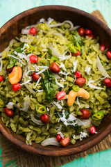 Hariyali Poha / Green Masala Pohe or flattened rice served in a bowl, selective focus