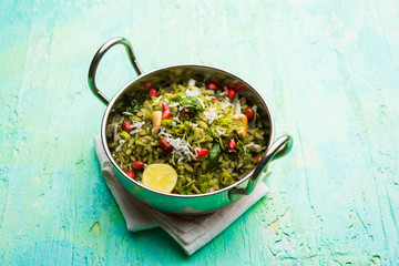 Hariyali Poha / Green Masala Pohe or flattened rice served in a bowl, selective focus