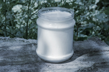 can of milk closeup on a wooden board. Tinted.