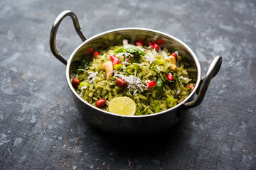 Hariyali Poha / Green Masala Pohe or flattened rice served in a bowl, selective focus