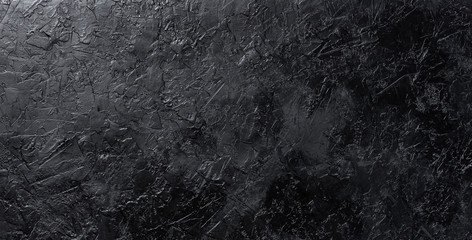 Black stone texture, dark slate background, top view