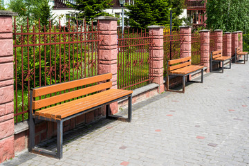 wooden seating in the city on a sunny day