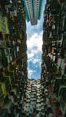 Hong Kong, China - May 19, 2019: Looking up at old building to sky in perspective view Architecture of Yick Fat Building located in east of Hong Kong's Central Business District