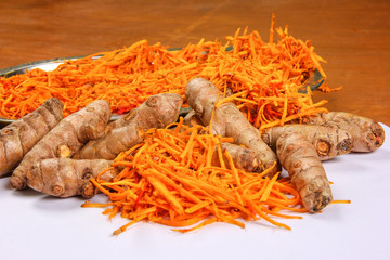 turmeric (curcuma) on wooden background