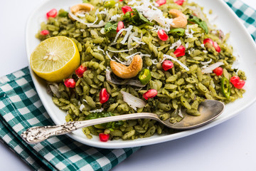 Hariyali Poha / Green Masala Pohe or flattened rice served in a bowl, selective focus