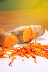 turmeric (curcuma) on wooden background