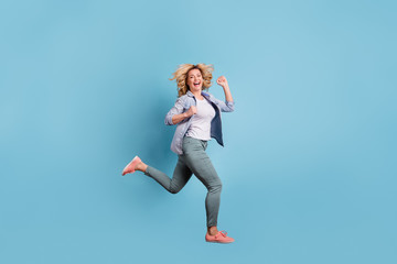 Full size profile side photo of nice lady running laughing wearing pants trousers isolate dover...