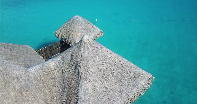 Beach travel vacation Tahiti hotel overwater bungalows luxury resort in coral reef lagoon ocean. Moorea, French Polynesia, Tahiti, South Pacific Ocean. Bora Bora