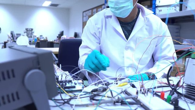 Scientist working in the lab,Highly skilled scientists and engineers are in a position to check the operation of the new project.