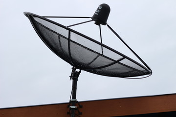 Satellite dish on roof background.