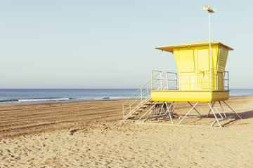Yellow lifeguard station on the beach