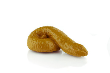 Fake rubber dog or human poop isolated on a white background.