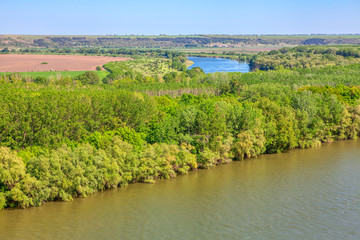 Fototapeta na wymiar aerial view of spring nature with green forest and river