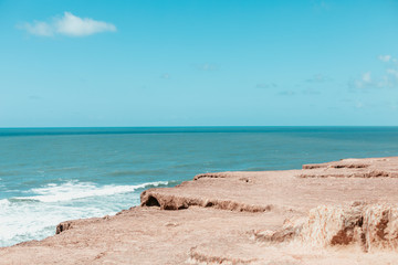 paradise beach without people with hills and palm trees