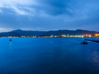 Distant lights and structures of Batumi port early in the morning