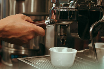 Fototapeta na wymiar Close up Barista Hand Cafe Making Coffee Preparation , Selective Focus