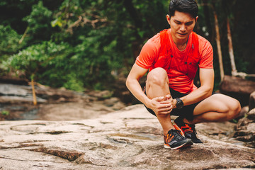 Runners. Young people  trail running on a mountain path. Adventure trail running on a mountain. Runners receive injuries from running trails on a mountain
