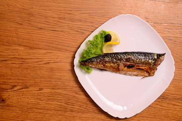 Smoked mackerel with vegetables grilled on a white plate. Beautiful exposure tasty Mediterranean...