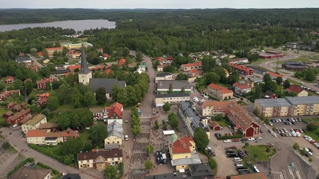 Revealing drone footage revealing the pre start of an MTB race with mountainbikes laying on the street marking the start position. Filmed in realtime.