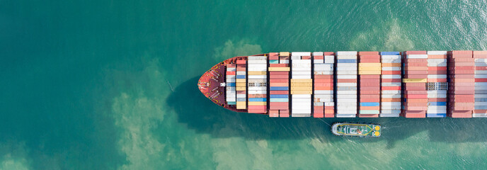 Aerial view and top view. Container ship in pier with crane bridge carries out export  and import...
