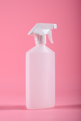 Cleaning tools. Spray bottle isolated on pink background. Mock up