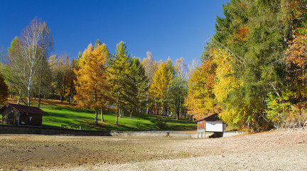 Dried river bed in Bavaria in autumn boathouse