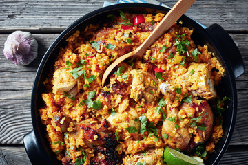 Arroz con pollo in a black saucepan