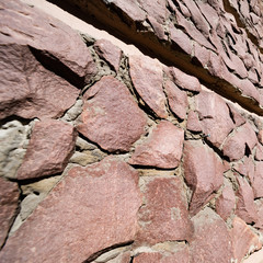 Large stone wall with a screw