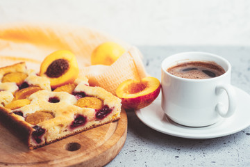 Homemade apricot pie and a Cup of espresso. Breakfast