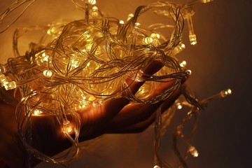 Hand holding LED String Light that are used to decorate the festival