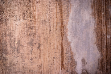 Fototapeta premium Red dirty plaster wall. Ancient background and texture.