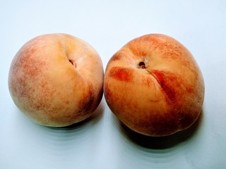 Fototapeta na wymiar A picture of peaches on white background