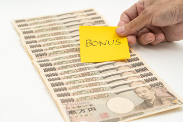 Hand stick bonus post it stick on 10000 yen banknote