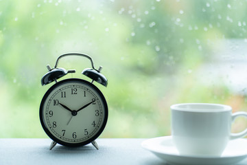 Vintage clock time at ten pass ten o'clock and coffee cup