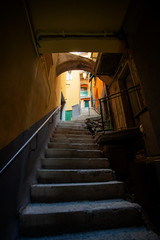 Narrow streets in Riomaggiore town at Cinque Terre, Italy in the summer