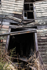 Collapsed door of dilapidated house