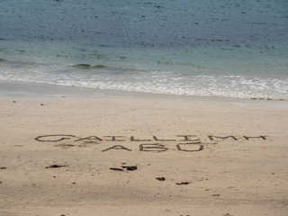Gaillimh Abu sign on a sand by atlantic ocean, Galway, Ireland.
