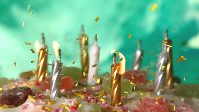 Candles on a birthday cake and confetti