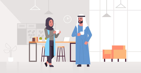 arabic businesspeople couple drinking cappuccino arab business man woman discussing during meeting coffee break concept modern office lounge area interior full length horizontal