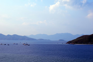 Beautiful Landscape In Binh Thuan Province. Travel background .Chairs and sun umbrella on the Sandy island sea beach.