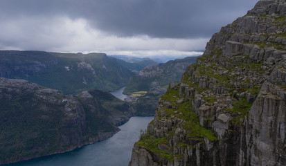Naklejka premium FORSANN, NORWAY - july 2019: Photo of On top of Pulpit Rock (Preikestulen)