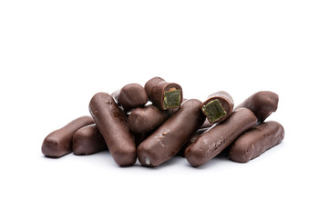candied ginger covered with dark chocolate, on white background