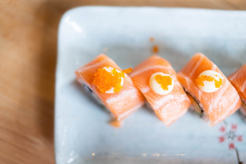 Top view of Salmon sushi roll, Japanese food. (selective focus point)