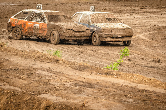 Traditional rally .The racing car drives into a steep turn, scattering, spraying dirt, dust. Extreme rally, autocross