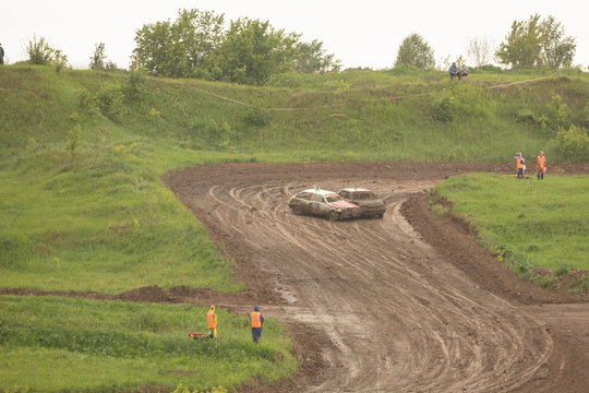 Traditional rally .The racing car drives into a steep turn, scattering, spraying dirt, dust. Extreme rally, autocross